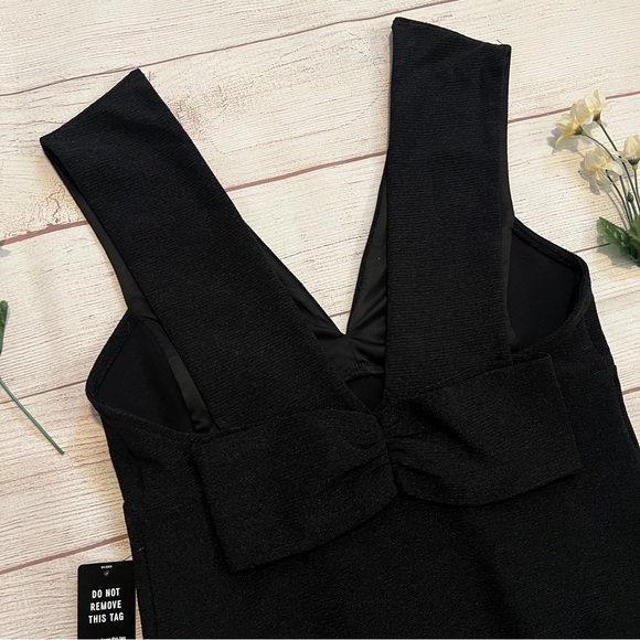 EXPRESS Ribbed Plunge Neck Bow Back Thong Bodysuit - Picture 9 of 16